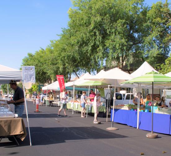 individuals shopping at farmers market