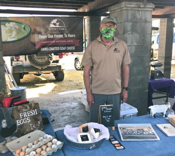 Vendor selling dairy products at farmers market