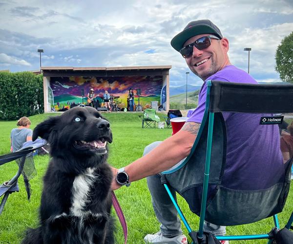 A dog and it's owner at Music & Market in Granby