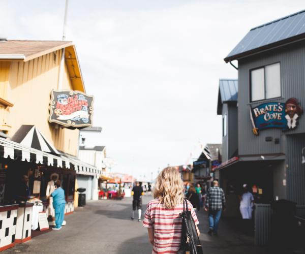 Woman walking at Old Fisherman's Wharf in Monterey