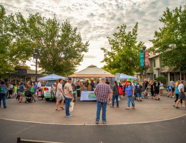 Customers shop at vendor booths at Old Town Clovis Farmers Market