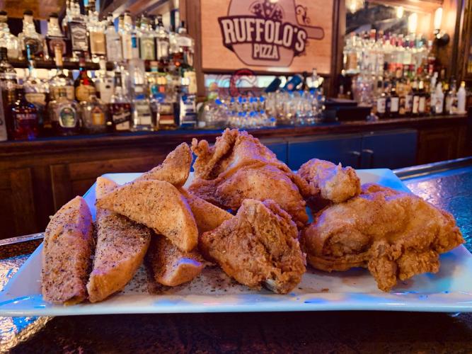 Chicken Dinner with Mojos and bar in background