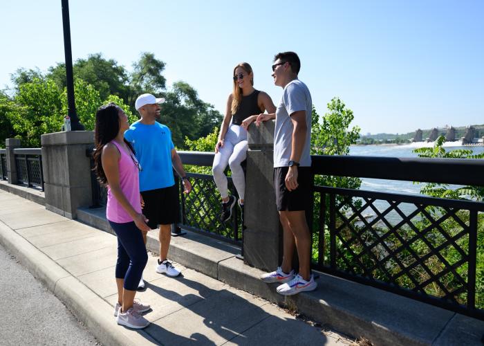 Couples chatting at Origin Park with river view
