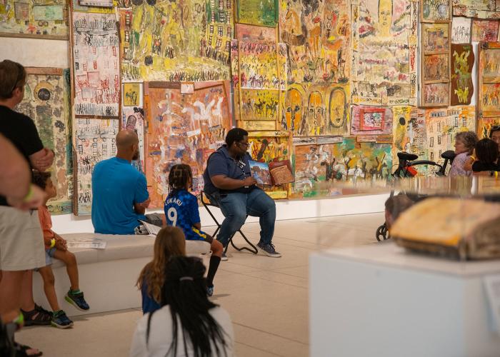 Tampa Museum of Art staff reads a children's book as part of a Family Day activity in the galleries