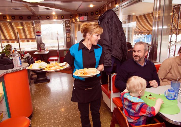 Waitress serving food at Connies Diner