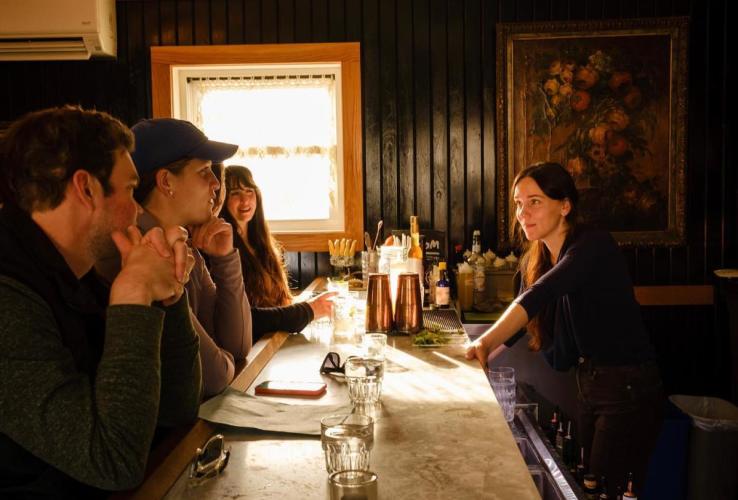 Group of people sitting at the bar