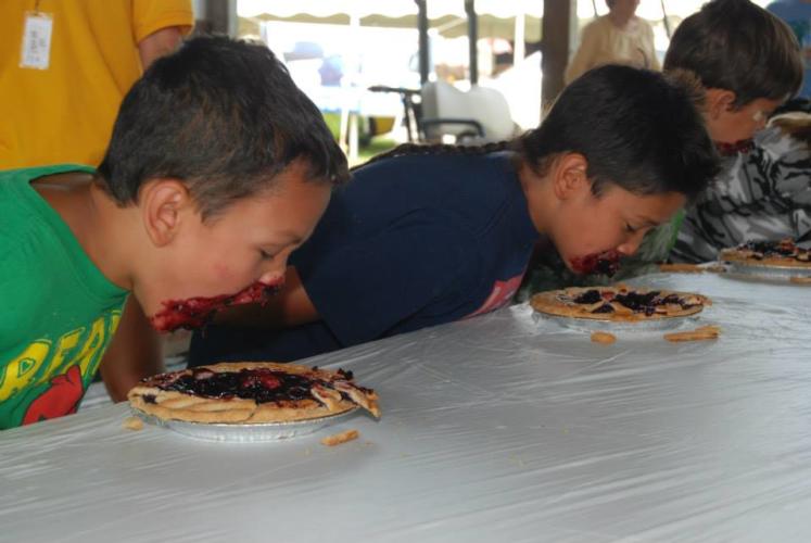 Saratoga Co. Fair two boys participating in the pie eating contest