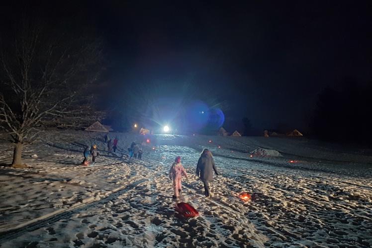 Sledding at Jelly Bean Hill on Community Glow Night