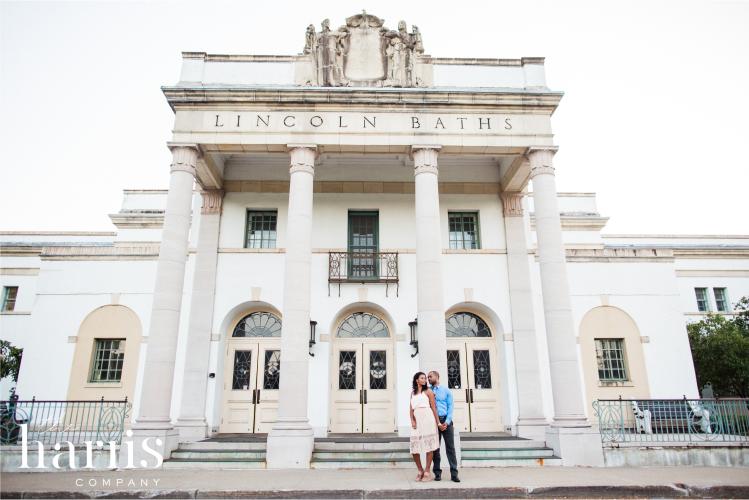 Couple posing outside of Lincoln Baths in Saratoga Springs, NY