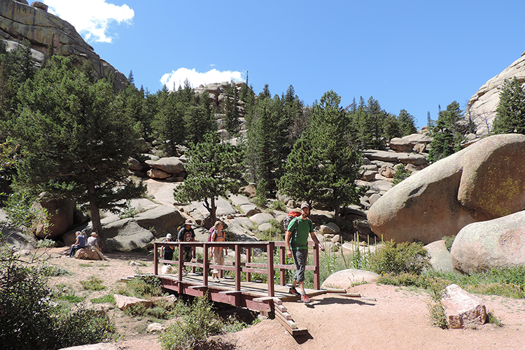 A family hiking on a sunny day at Turtle Rock Trail near Cheyenne.
