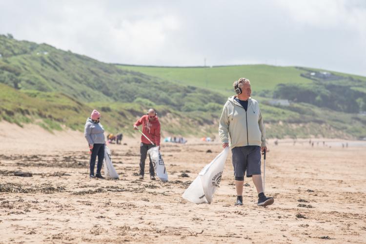Silent disco beach clean at Woolacombe Beach Devon, National Trust Images Arnhel de Serra