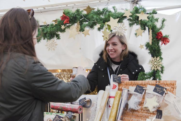 visitors browsing stalls at Buckland Abbey