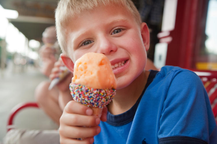 Young boy eating Peach Ice Cream