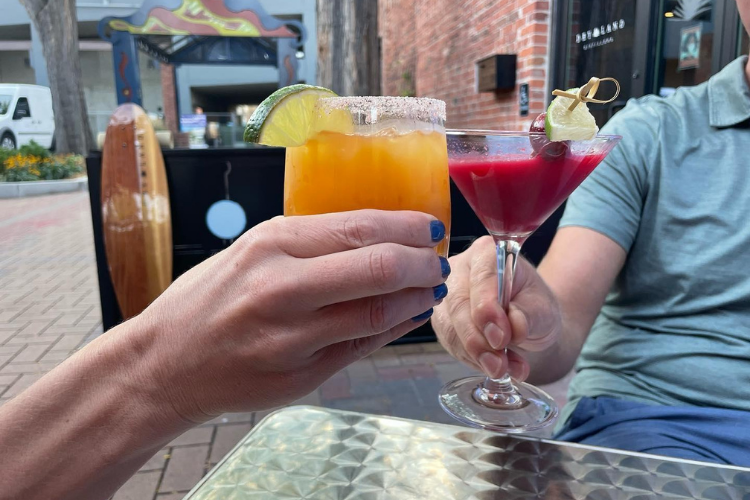 A couple enjoying cocktails at Dry Land Distillers