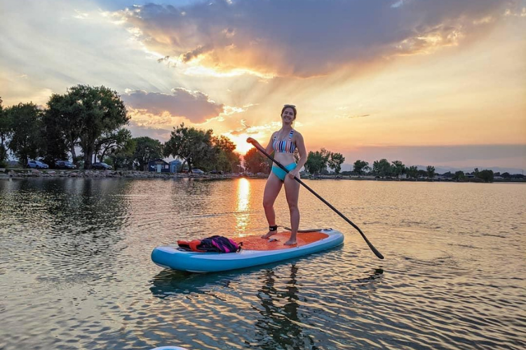 A woman paddleboarding on Union Reservoir