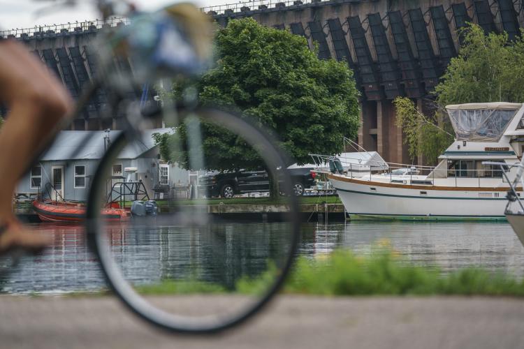A biker riding past the ore dock in Lower Harbor