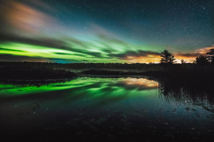 Green Auroras over the sky in Big Bay, MI
