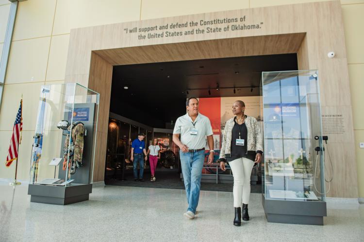 Two people walking at the National Guard Museum