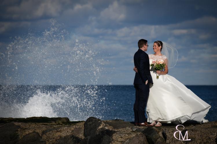Erin Malcolm photo of bride and groom along the ocean surf