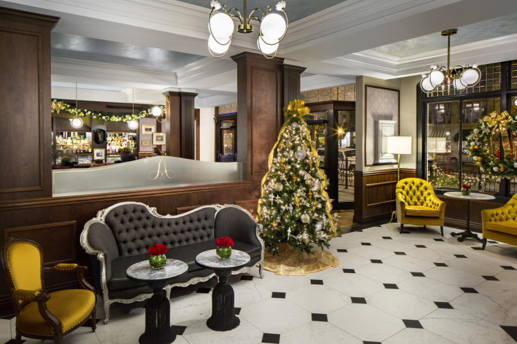 Adelphi lobby with decorated Christmas trees and holiday decor