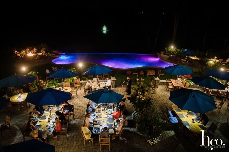 Nightime shot of the patio and pool at Prime at Saratoga National Golf Club