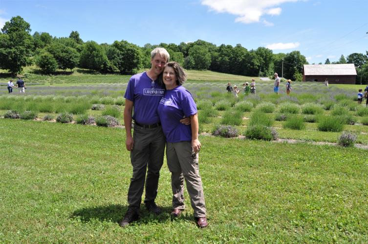 Dave and Diane Allen standing in front of lavender fields at Lavenlair Farm