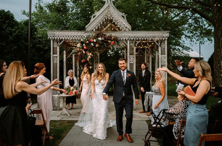 Bridal couple walking back up the aisle after exchanging vows