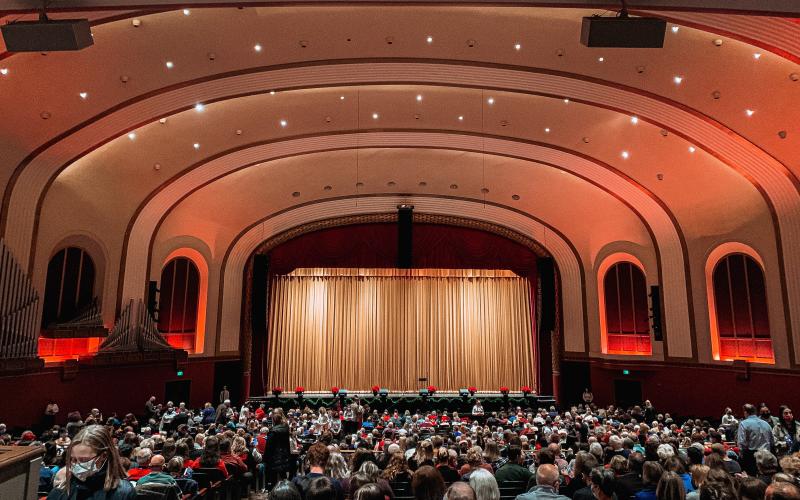 An audience at IU Auditorium ahead of the Chimes of Christmas concert
