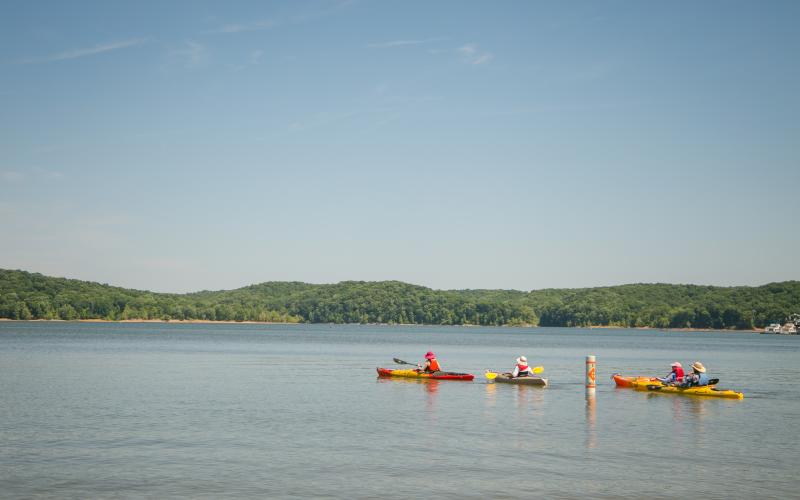 Four people kayaking on Monroe Lake