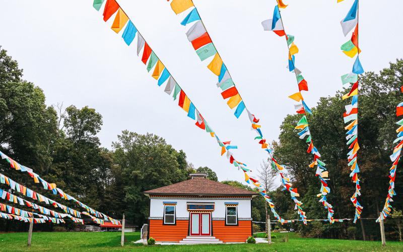 Prayer flags and a building at the Tibetan Mongolian Buddhist Cultural Center