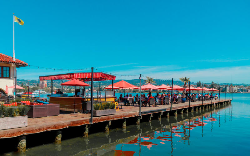 Lake Chalet dining on the water under shade umbrellas