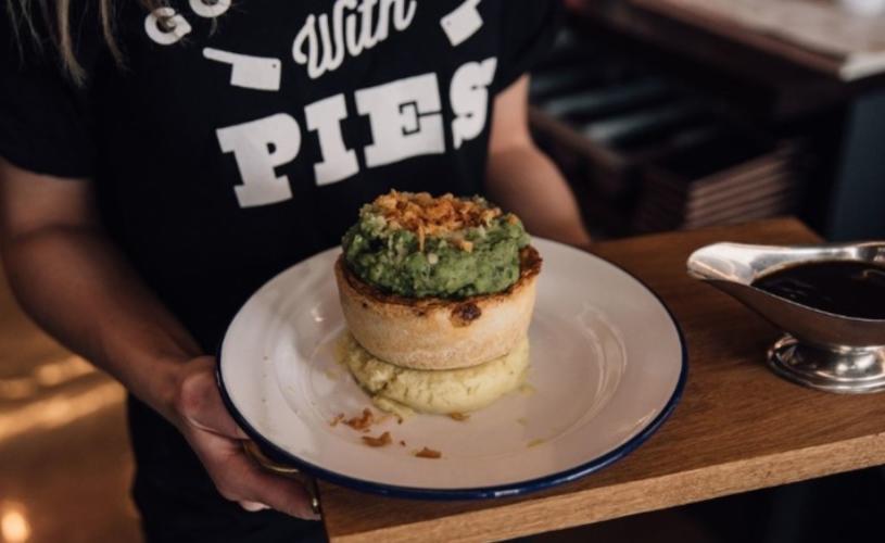 Person holding a plate with pie and mash - credit Pieminister