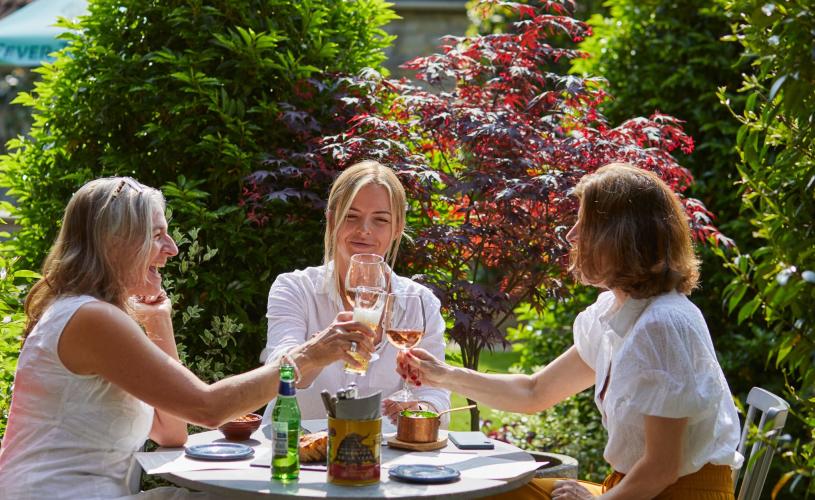 Group of women with drinks in the beer garden at The Swan in Wedmore