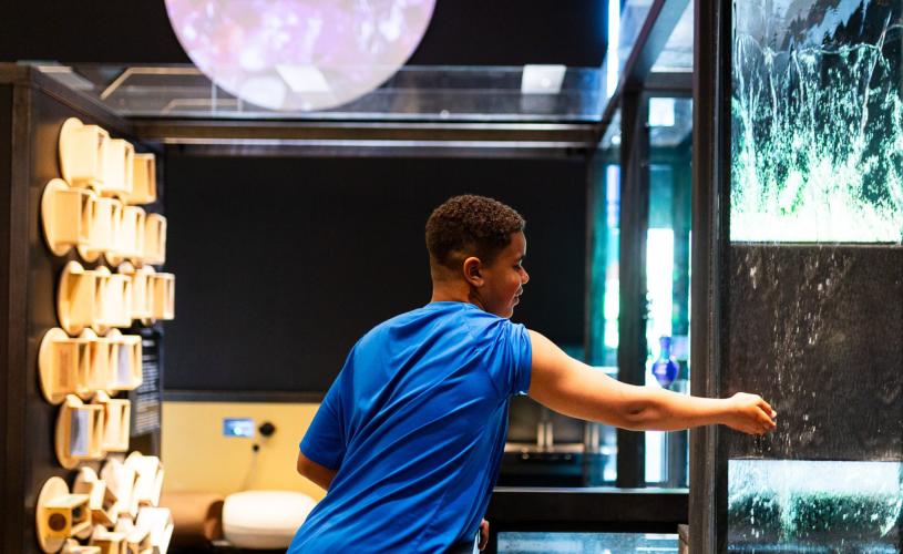 Boy playing with exhibit at We The Curious, Bristol - credit Lisa Whiting