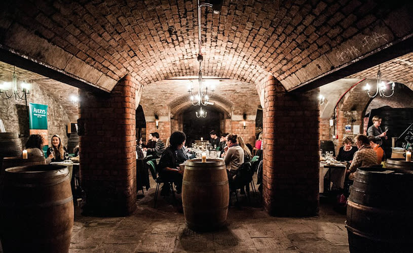 An underground brick wine cellar - Credit Averys Wine