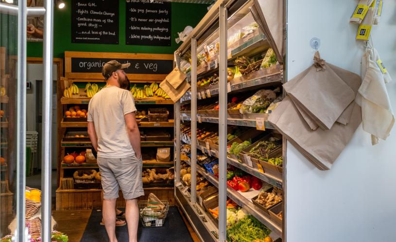 A man browsing the store at Better Food, Wapping Wharf on Bristol's Harbourside - credit Hey What