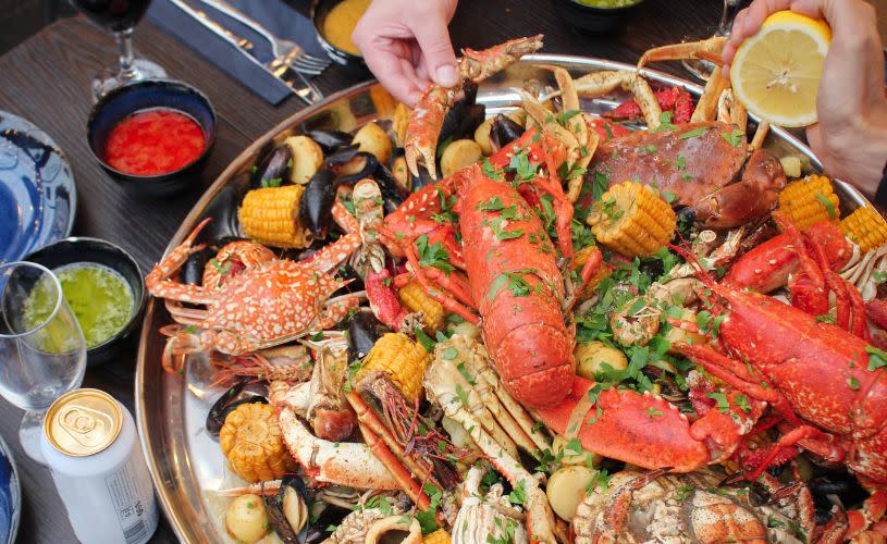 Seafood boil platter with dips and drinks - credit Fisk & Frite