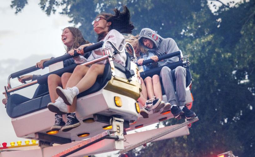 Children on rides at Bristol International Balloon Fiesta - Credit Paul Box