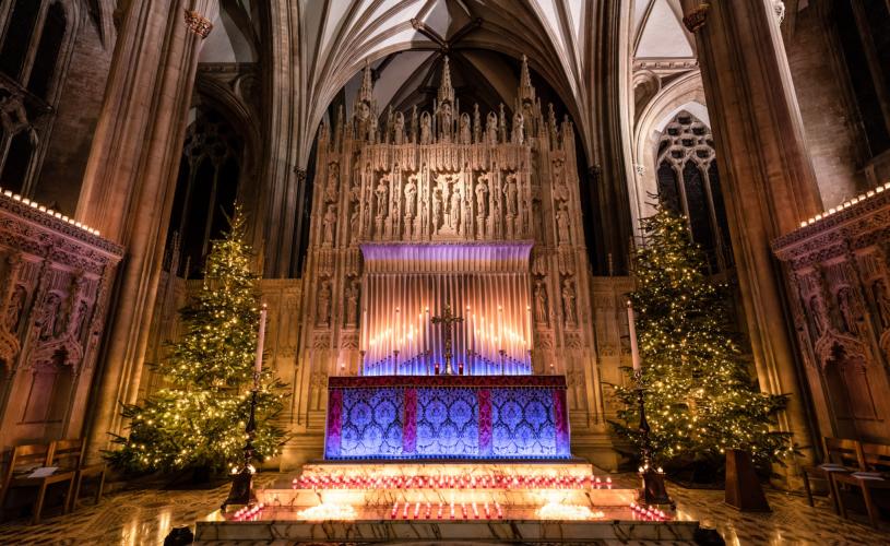 Bristol Cathedral alter with Christmas trees and candles  - Credit Bristol Cathedral