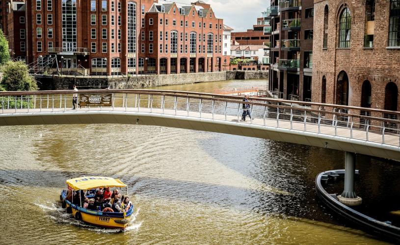 A Bristol Ferry Boat sailing under Castle Bridge in Finzels Reach, towards Bristol's Harbourside