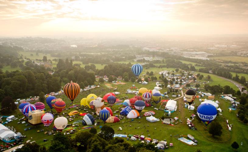 A group of balloons lifting off in a mass ascent at Bristol International Balloon Fiesta - credit Adam Gasson