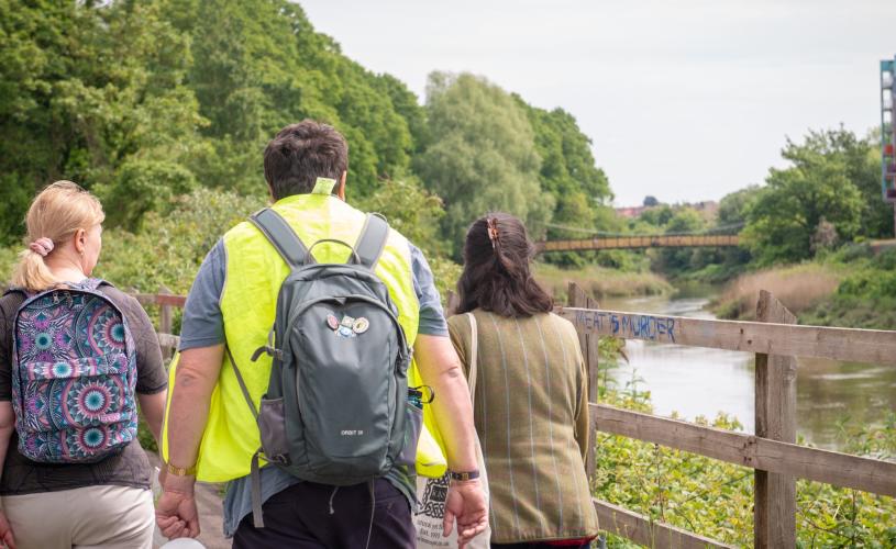 A group of people walking along river path in Brislington, Bristol, as part of Bristol Walkfest - credit Katie Murt
