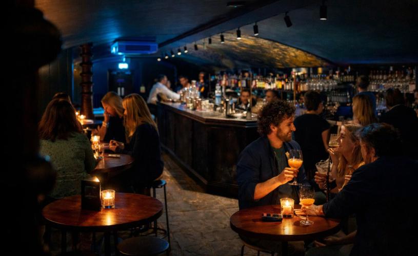 People drinking cocktails at The Granary Club cocktail bar - credit The Granary