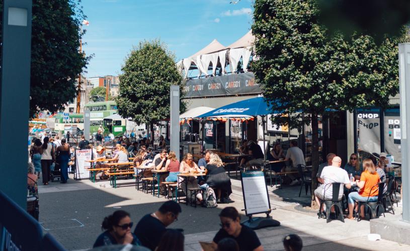People dining alfresco at Wapping Wharf on Bristol's Harbourside - credit Jon Craig