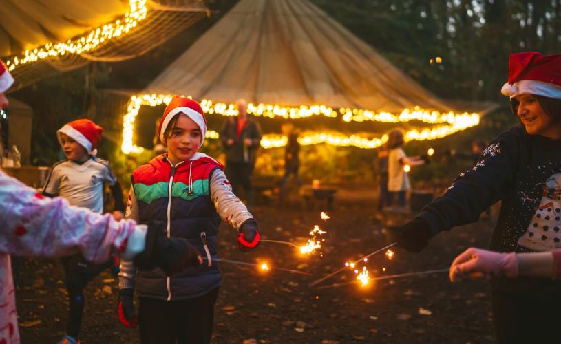 Children with Christmas sparkelers at Mendip Activity Centre - credit Mendip Activity Centre