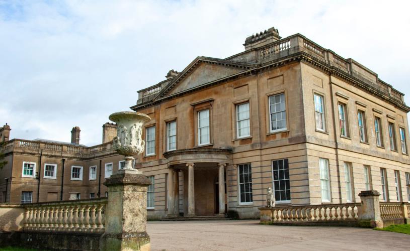 A two-storey grand house in a plain style, with tall windows on each storey.