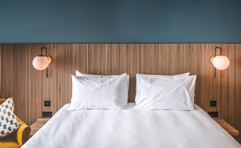 Double bed with chair - Credit Mollie's Motel and Diner