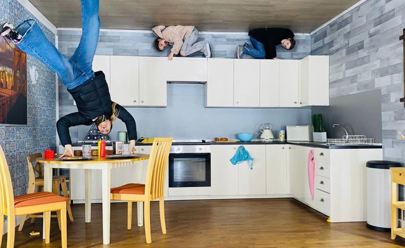 Family playing in kitchen - credit Upside Down House