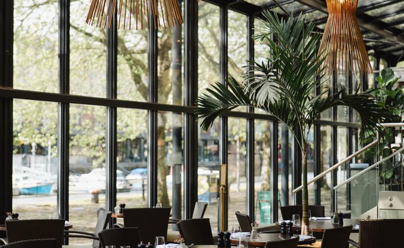 The River Grille restaurant interior with large glass windows - credit The Bristol - Doyle collection