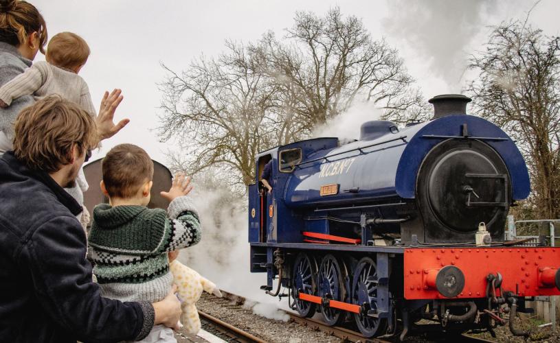Family waving at train at Avon Valley Railway near Bristol - credit Avon Valley Railway